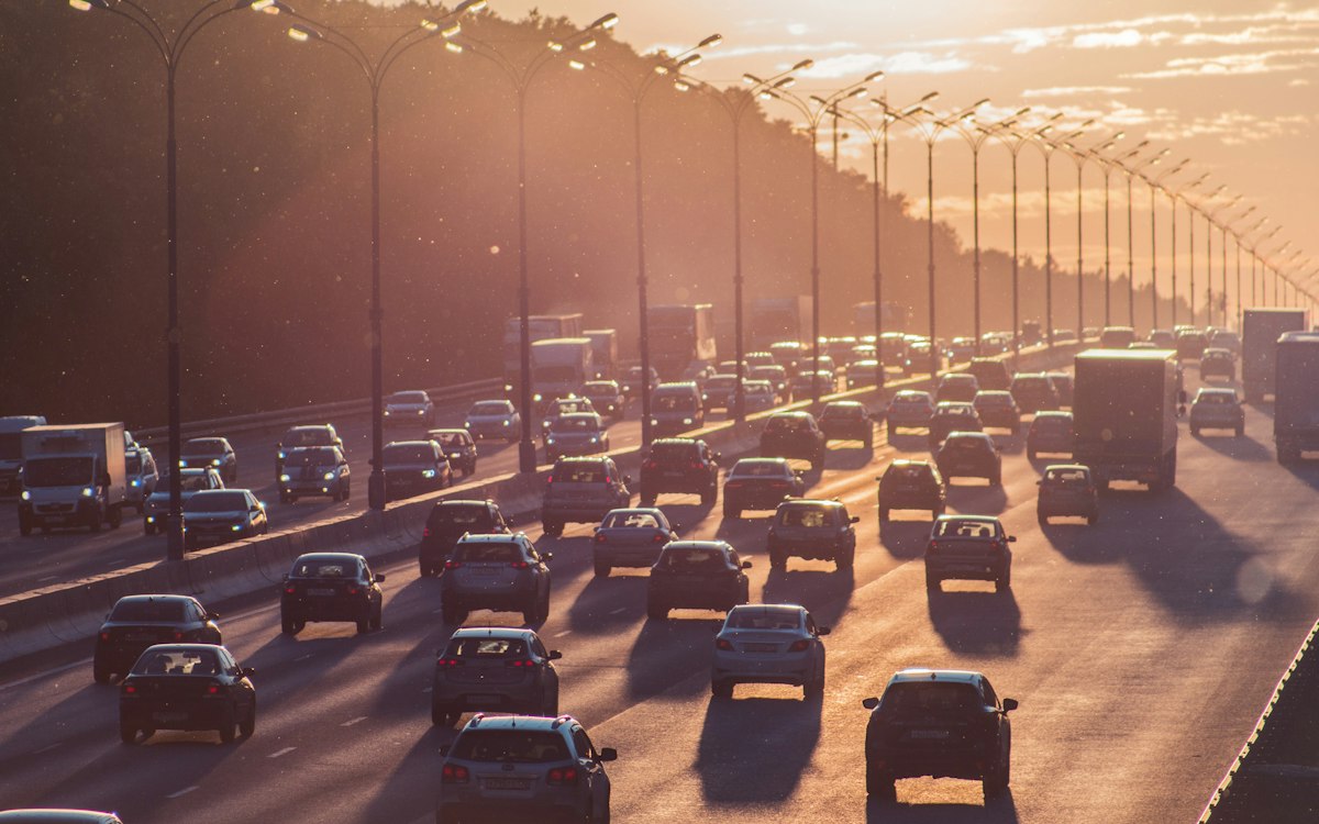 Dense traffic on a highway at sunset