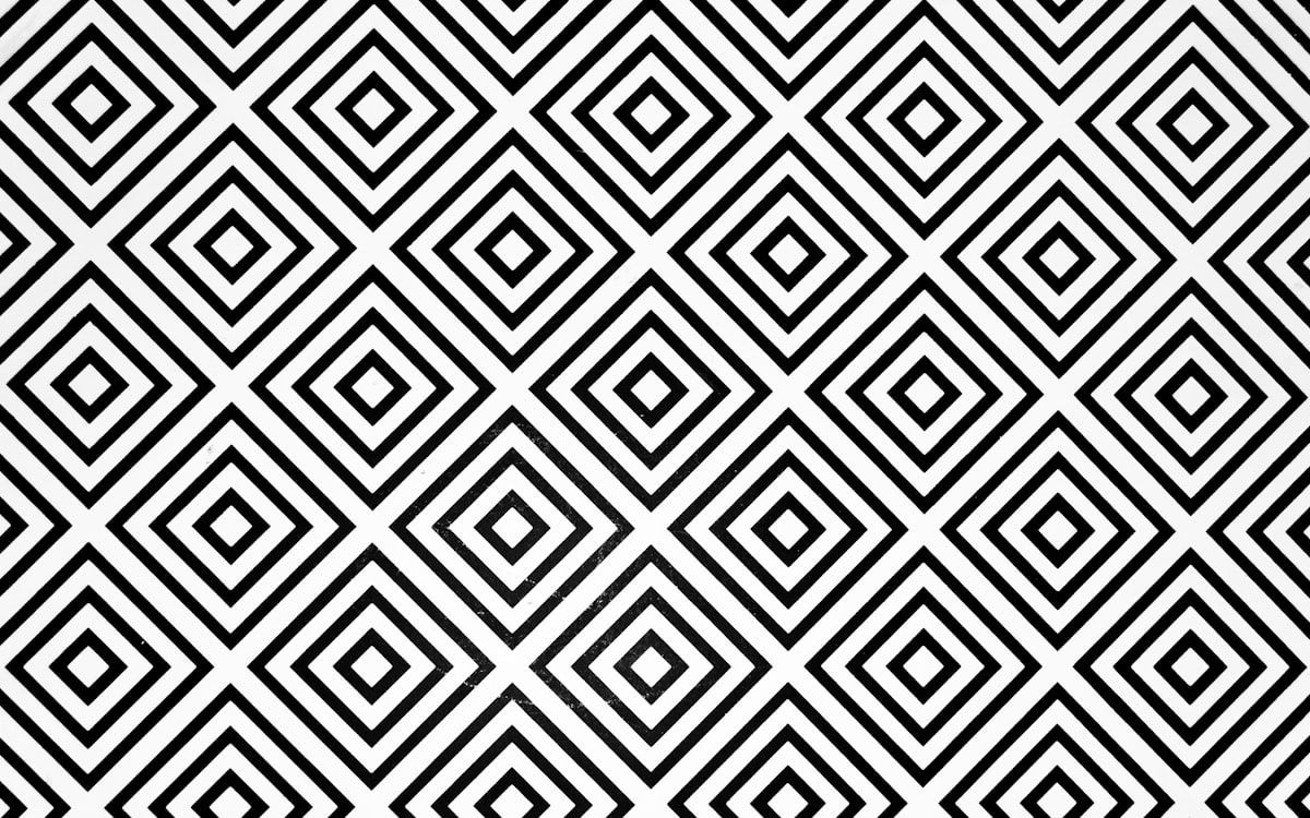 Repeating geometric pattern in black and white